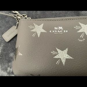 Like New! Grey Coach Wristlet with Silver Stars
